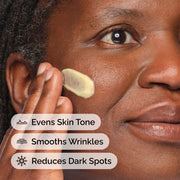 Close-up of a person applying The Ordinary's yellow Retinal 0.2% Emulsion to their cheek. Text overlays highlight the product's benefits: Evens Skin Tone, Smooths Wrinkles, and Reduces Dark Spots.