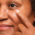 Model applies Volufiline serum to undereyes
